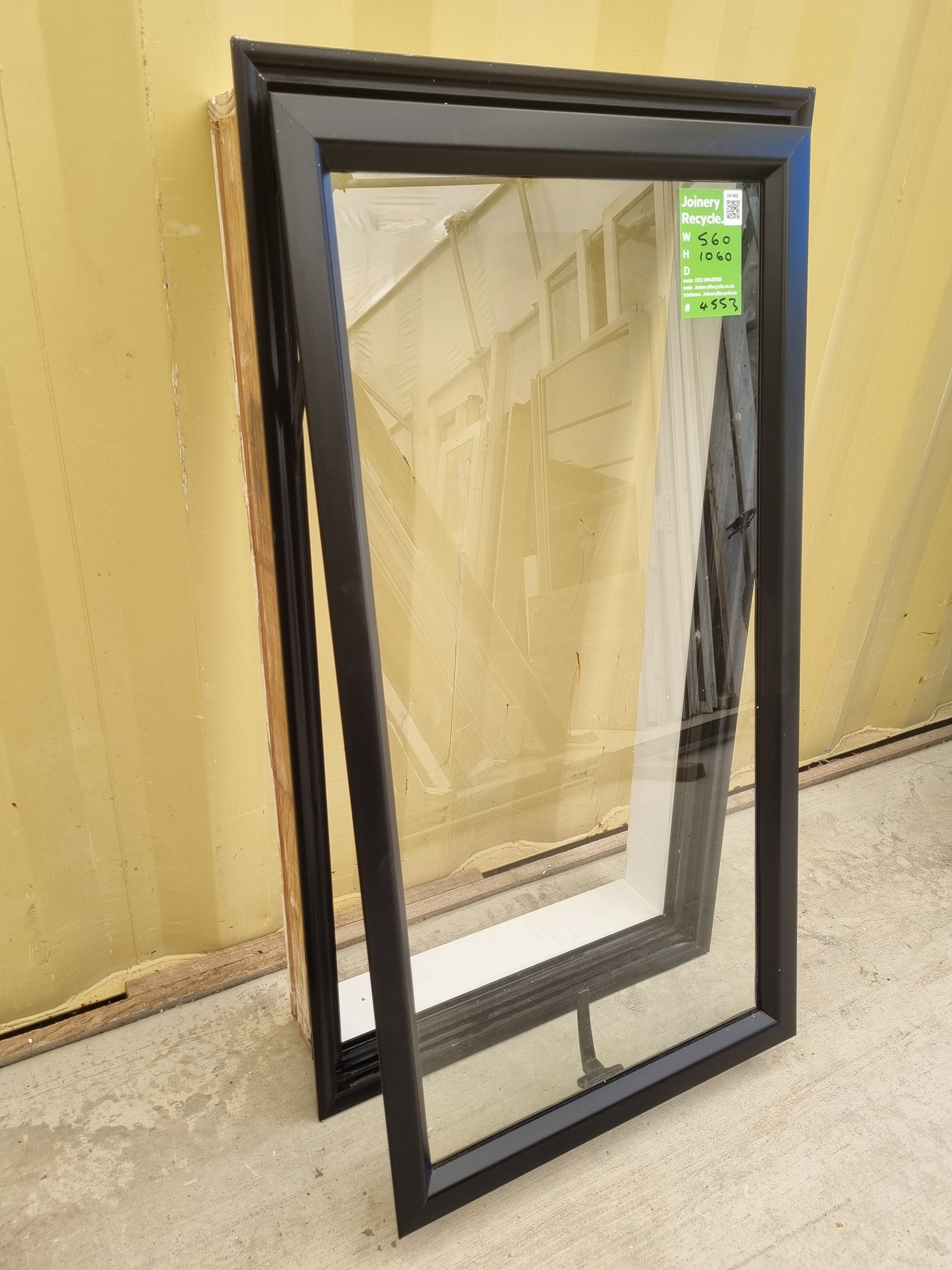 Second-hand Black Aluminium Window with an awning opening sash. Size: 560 mm Wide x 1060 mm High. side view