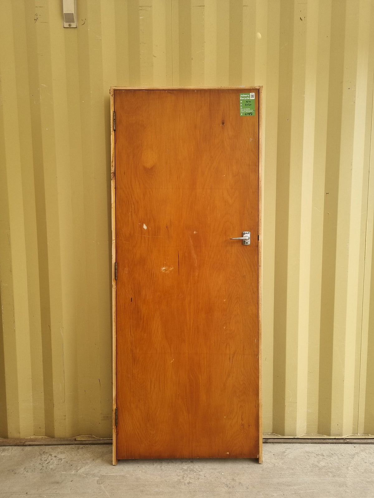 Secondhand framed rimu veneer internal door with chrome lever door handle.  Bedroom or hallway door for 1940s - 1950s Bungalow or State House